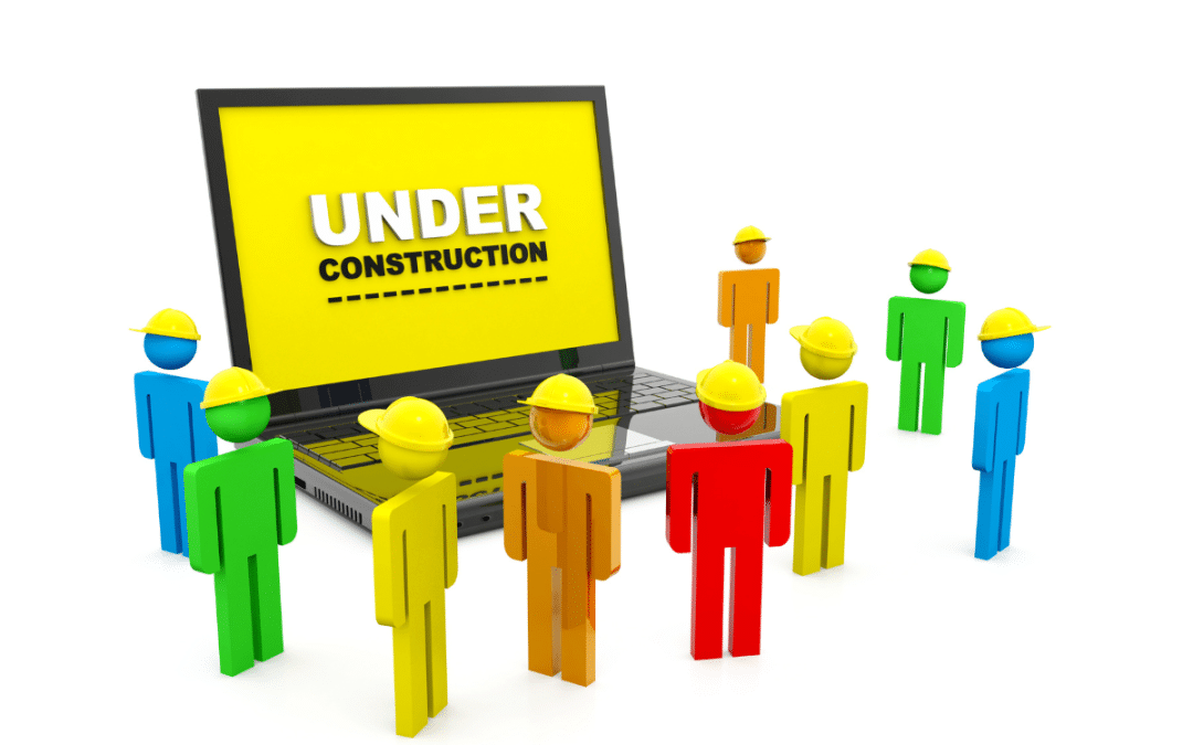 Cartoon figures with hard hats surround a laptop displaying an 'Under Construction' message.